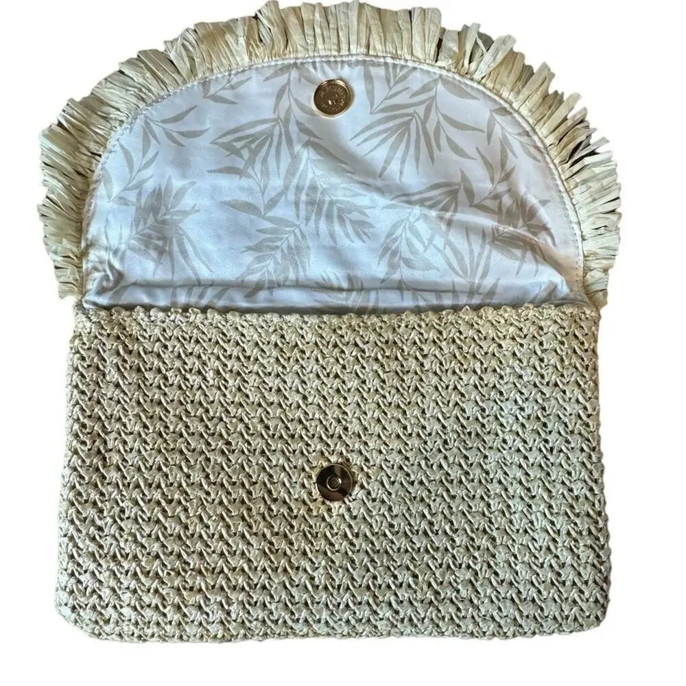 The North Shore Natural Frayed Tassel Clutch